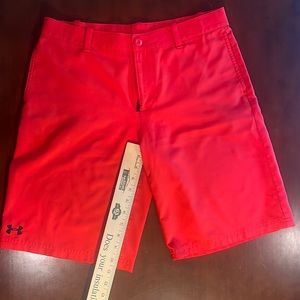 Under Armour, YXL red golf shorts.